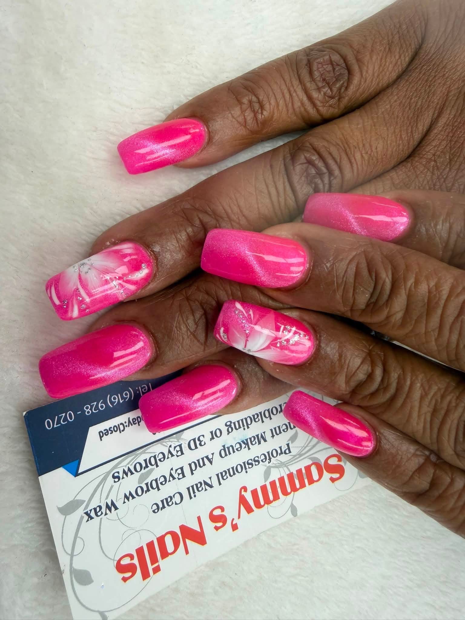Hot pink cat eye nails with marble accent — Sammy's Nails Holland MI