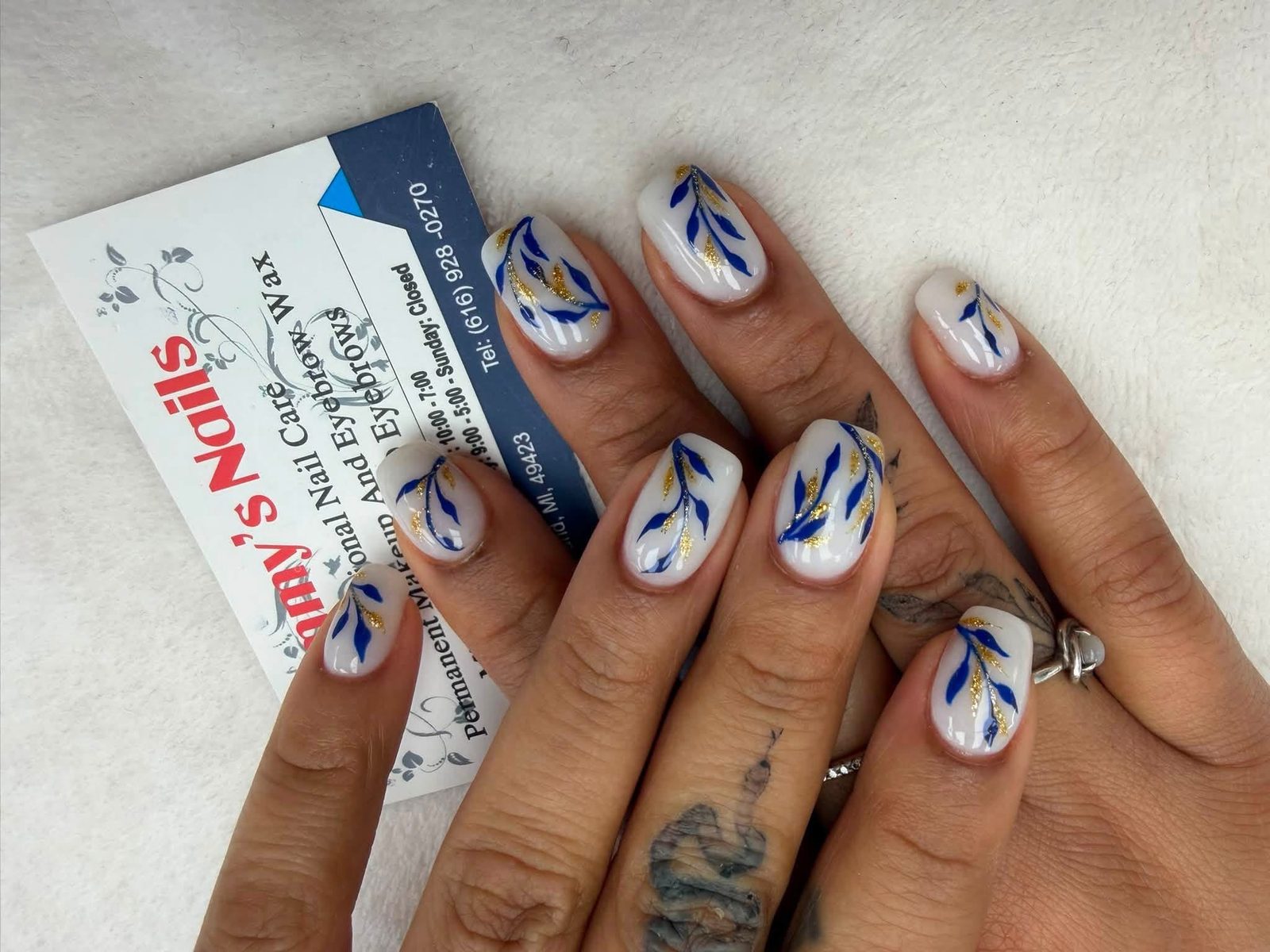 Blue cat eye nails with silver star accents — Sammy's Nails Holland MI