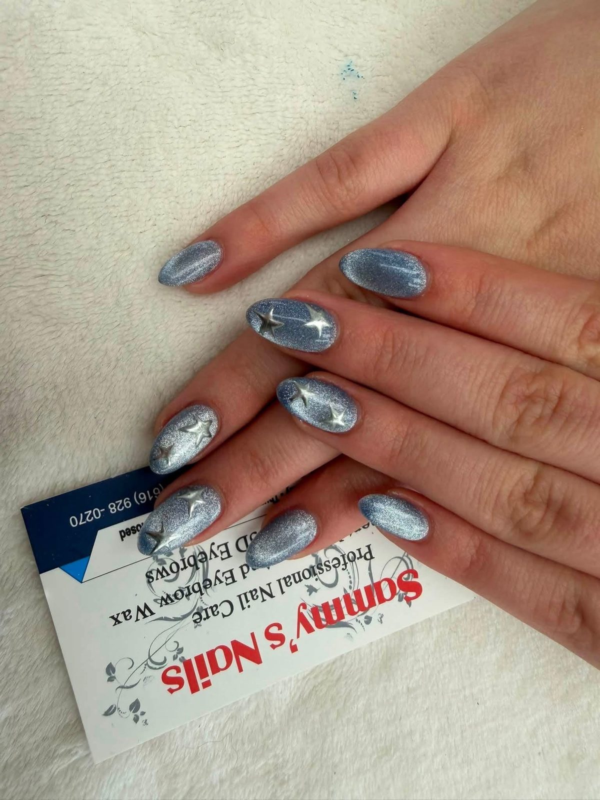 White nails with blue botanical leaf art — Sammy's Nails Holland MI